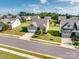 Aerial view of a beautifully landscaped home with a well-manicured lawn and a charming neighborhood at 15429 Topanga Dr, Charlotte, NC 28278