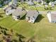 Aerial view showcasing the homes and green space within this well-planned community, perfect for families at 15429 Topanga Dr, Charlotte, NC 28278