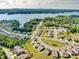 Stunning aerial view of a waterfront community with lake access, lush greenery, and well-maintained landscaping at 15429 Topanga Dr, Charlotte, NC 28278