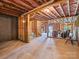 Unfinished basement featuring exposed ceiling, wooden frame and concrete flooring, ample space to add living area at 15429 Topanga Dr, Charlotte, NC 28278