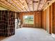 Unfinished basement space featuring natural light from the window and ample room for flexible usage at 15429 Topanga Dr, Charlotte, NC 28278