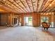 Spacious unfinished basement with sliding door access to the outside, exposed insulation, ready for customization at 15429 Topanga Dr, Charlotte, NC 28278