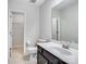 Bathroom featuring white fixtures, toilet, and a large mirror at 15429 Topanga Dr, Charlotte, NC 28278