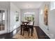 Traditional dining room featuring a dark wood table, chairs, a decorative rug, and lots of natural light at 15429 Topanga Dr, Charlotte, NC 28278