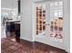 Entryway featuring dark hardwood floors, glass paneled french doors and an elaborate oriental rug at 15429 Topanga Dr, Charlotte, NC 28278
