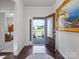 Open entryway features hardwood floors, an open front door, and a painting on the right wall at 15429 Topanga Dr, Charlotte, NC 28278