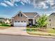 Charming brick home with a two-car garage and well-manicured landscaping at 15429 Topanga Dr, Charlotte, NC 28278