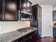 The kitchen features granite counters, stainless steel appliances, a gas range and dark cabinets at 15429 Topanga Dr, Charlotte, NC 28278