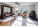 Unique living room featuring a decorative swing and ample natural light from three large windows at 15429 Topanga Dr, Charlotte, NC 28278