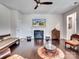Bright living room showcases a cozy fireplace, dark hardwood floors, and unique decorative accents at 15429 Topanga Dr, Charlotte, NC 28278