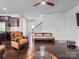 Spacious living room with a fireplace, hardwood flooring, and an open layout connecting to other areas of the home at 15429 Topanga Dr, Charlotte, NC 28278