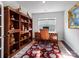 Office featuring a hardwood floor, ornate desk, and decorative shelving at 15429 Topanga Dr, Charlotte, NC 28278
