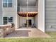 Outdoor patio with built-in grill, comfortable seating, and under-deck coverage for entertaining and relaxing at 15429 Topanga Dr, Charlotte, NC 28278