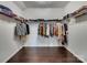 Spacious walk-in closet with ample shelving and hardwood flooring at 15429 Topanga Dr, Charlotte, NC 28278