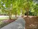 Picturesque walking path lined with trees and fresh landscaping at 15429 Topanga Dr, Charlotte, NC 28278