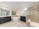 Bright bathroom includes a separate shower, garden tub, dual sink vanity and natural light through a window at 15536 Oleander Dr # L228, Charlotte, NC 28278