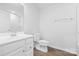 Modern bathroom featuring vanity sink, toilet, and large mirror at 1747 Slippery Rock Ln, Monroe, NC 28112