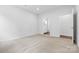 Bright bedroom featuring carpet floors with an ensuite bathroom at 1747 Slippery Rock Ln, Monroe, NC 28112