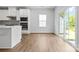 Bright dining area featuring hardwood floors, modern finishes, and a view to the outside at 1747 Slippery Rock Ln, Monroe, NC 28112