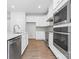 Modern kitchen featuring stainless steel appliances and white cabinets at 1747 Slippery Rock Ln, Monroe, NC 28112