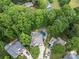 Aerial view of a backyard oasis with a sparkling pool and lush landscaping at 19507 Dufour Ct, Cornelius, NC 28031