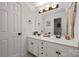 Bright bathroom features double vanity sinks and modern fixtures at 19507 Dufour Ct, Cornelius, NC 28031