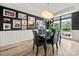 Elegant dining room with hardwood floors, decorative wall molding, and a stylish chandelier at 19507 Dufour Ct, Cornelius, NC 28031