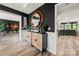 Welcoming hallway featuring modern decor, dark walls, and hardwood floors at 19507 Dufour Ct, Cornelius, NC 28031