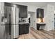Kitchen featuring stainless steel appliances, dark cabinetry, and modern countertops at 19507 Dufour Ct, Cornelius, NC 28031