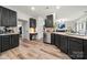 Modern kitchen with sleek cabinetry, stainless steel appliances, and ample counter space at 19507 Dufour Ct, Cornelius, NC 28031
