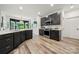 Modern kitchen with stainless steel appliances, dark cabinetry, and a functional layout at 19507 Dufour Ct, Cornelius, NC 28031