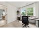 Bright office space featuring a desk, chair, and plenty of natural light from large windows at 19507 Dufour Ct, Cornelius, NC 28031
