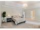 Spacious bedroom with trey ceilings, decorative chandelier, and a large walk-in closet at 20107 N Cove Rd, Cornelius, NC 28031
