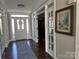 Welcoming foyer with hardwood floors, elegant trim, and bright natural light at 20107 N Cove Rd, Cornelius, NC 28031