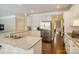 Open kitchen with white cabinets, stainless steel appliances, and granite countertops at 20107 N Cove Rd, Cornelius, NC 28031