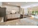 Well-lit kitchen showcases ample counter space, white cabinetry, and stainless steel appliances at 20107 N Cove Rd, Cornelius, NC 28031