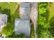 A top-down shot showcases the house's roof, long driveway, and surrounding trees at 204 S Elm St, Cherryville, NC 28021
