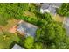 An aerial view of the house featuring a long driveway and trees at 204 S Elm St, Cherryville, NC 28021