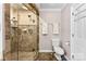 Beautiful bathroom featuring tiled walls, glass enclosed shower and decorative towels at 204 S Elm St, Cherryville, NC 28021
