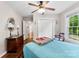 Inviting bedroom with hardwood floors, ceiling fan and sun-filled window at 204 S Elm St, Cherryville, NC 28021
