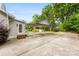 Exterior shot of home with an open carport and a well-maintained yard at 204 S Elm St, Cherryville, NC 28021