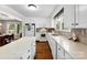 Spacious white kitchen featuring an island, modern appliances, and a view to the dining area at 204 S Elm St, Cherryville, NC 28021