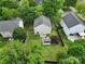 Aerial view of the property showcasing the backyard with a fire pit, shed, and privacy fence at 2117 Seabrook Ln, Fort Mill, SC 29715