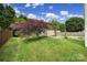 View of a well maintained backyard featuring a storage shed, fire pit, and basketball hoop at 2117 Seabrook Ln, Fort Mill, SC 29715