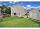 Well-maintained backyard featuring a fire pit, storage shed, and fenced perimeter for privacy at 2117 Seabrook Ln, Fort Mill, SC 29715