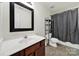 Bathroom featuring a wood vanity with sink, toilet, and a shower with grey curtain at 2117 Seabrook Ln, Fort Mill, SC 29715