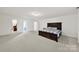Expansive bedroom featuring neutral carpet, a king bed, and multiple doorways at 2117 Seabrook Ln, Fort Mill, SC 29715