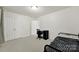 Bedroom with neutral carpet and walls, with a twin bed and closet access at 2117 Seabrook Ln, Fort Mill, SC 29715