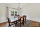 Elegant dining room with a large window, stylish chandelier, and classic decor at 2117 Seabrook Ln, Fort Mill, SC 29715