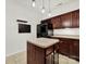 Kitchen featuring an island, wooden cabinetry, stainless steel appliances and wine rack at 2117 Seabrook Ln, Fort Mill, SC 29715